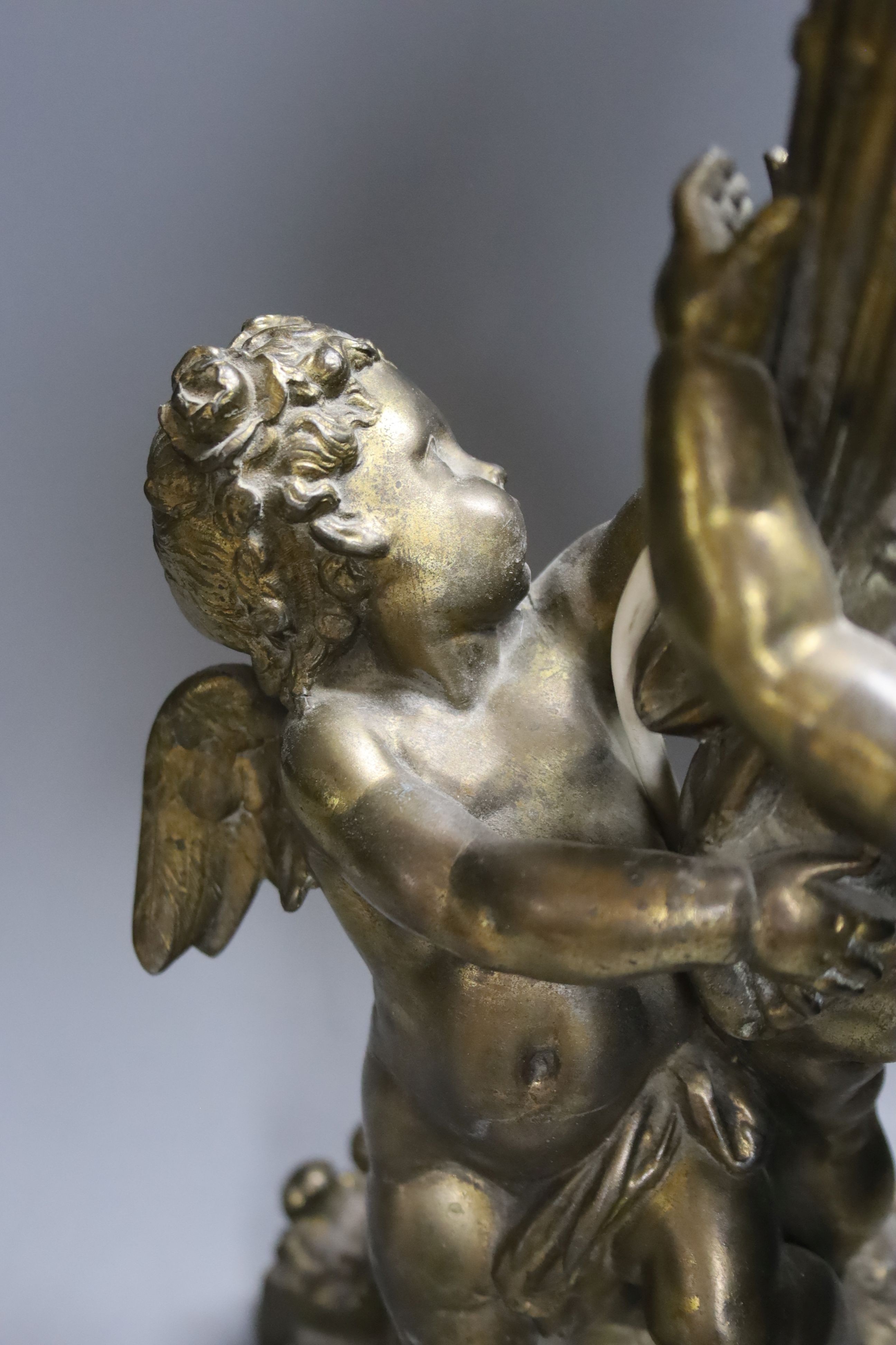 A gilt metal cherubic table lamp, signed, overall height 50cm